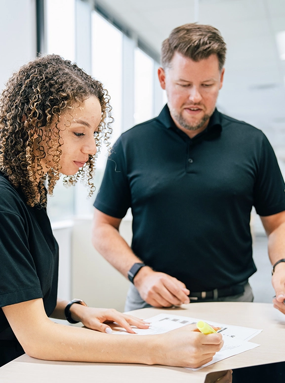 woman and man looking at forms for renting a vehicle in Jackson